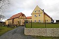 Residential stable house, barn, stable building and house for migrants from a four-sided farm