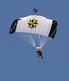 Member of the South African Special Forces performing a ceremonial parachute jump SADF-Special Forces-001.jpg