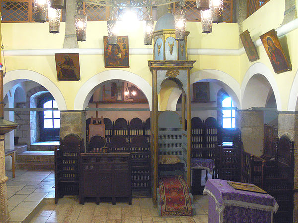 Wooden kathismata at the old Orthodox church in Sarajevo. The taller kathisma with gilded baldachin is for the bishop.