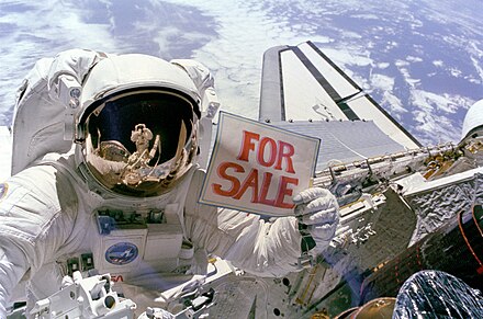NASA astronaut Dale Gardner jokingly advertises a recovered defective satellite as being "for sale" during a space walk.