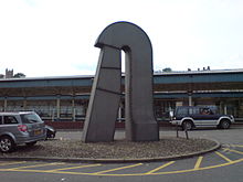 The Archform sculpture by Harvey Hood, in the station forecourt on the site of the old west-facing bay platform