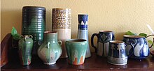 Group of Newcomb College Pottery pieces showing a variety of forms Selection of Newcomb College Pieces.jpg