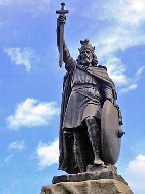 Alfred the Great statue in Winchester, Hampshire. The 9th-century English King proposed that primary education be taught in English, with those wishing to advance to holy orders to continue their studies in Latin. Statue d'Alfred le Grand a Winchester.jpg