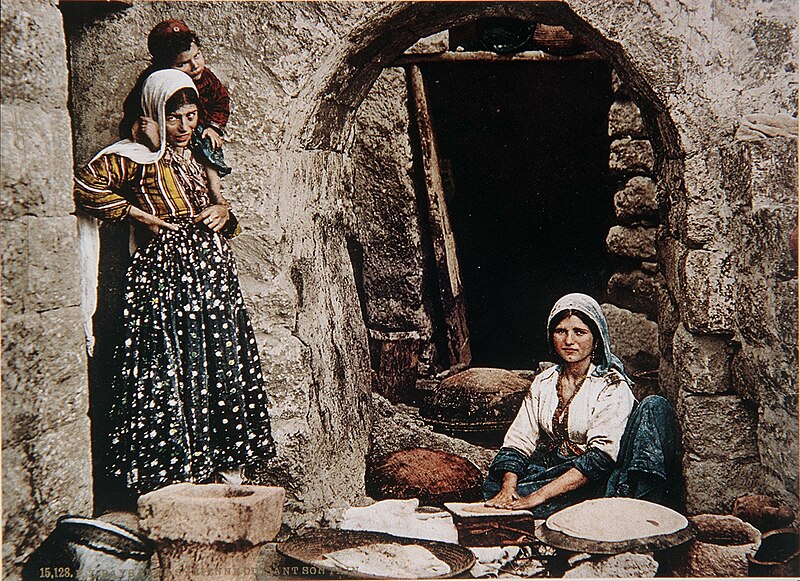 File:Syrian women baking bread. Colour photo by Bonfils.jpg