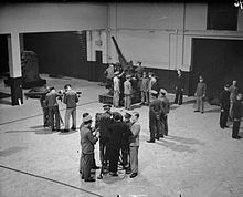 Men of a TA battery training on a 3-inch gun at their drill hall in 1938. TA3inchAATraining1938.jpg