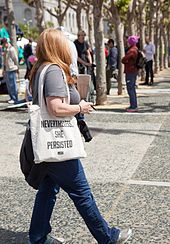 Tax March attendee in San Francisco carrying a tote bag displaying the phrase Tax March San Francisco 20170415-3823.jpg