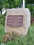 Memorial stone with "Spirit of the Elbe" plaque.