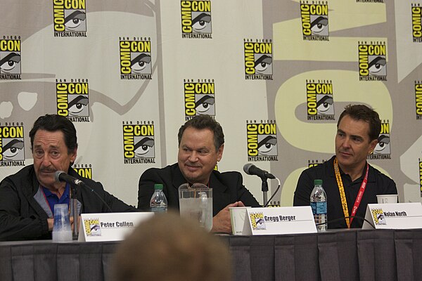 Peter Cullen, Gregg Berger, and Nolan North at the Fall of Cybertron panel at the 2012 Comic-Con International.