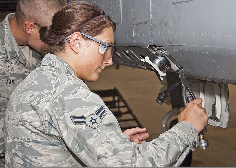 File:U.S. Air Force Airman 1st Class Jamie Rosenmeier, foreground, with the 363rd Training Squadron, trains to work as part of a load crew to remove and install an LAU-106 missile launcher from the weapons pylon of a 110623-F-NS900-002.jpg