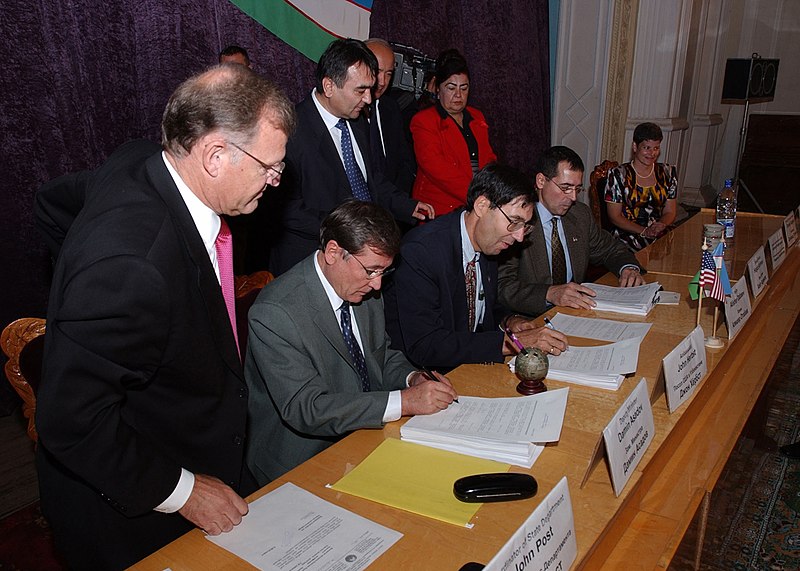 File:US Navy 021024-N-5329L-001 John Herbst, U.S. Ambassador to Uzbekistan, and Hakim Alisher A. Atabaev, Mayor of the Fergana region, sign the official turnover documents between the republic of Uzbekistan and the United States.jpg