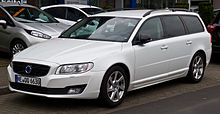 Front drivers side view of white V70 with glass black trim