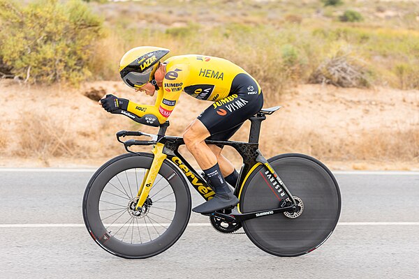 Primož Roglič riding a time trial bicycle in the 2022 Vuelta a España