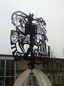 The sculpture in front of the school WCCI Mural.jpg