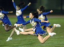 American military brat cheerleaders at a game at Yokota High School, a U.S. Department of Defense school on an American Air Force base in Yokota, Japan Yokota cheerleaders.jpg