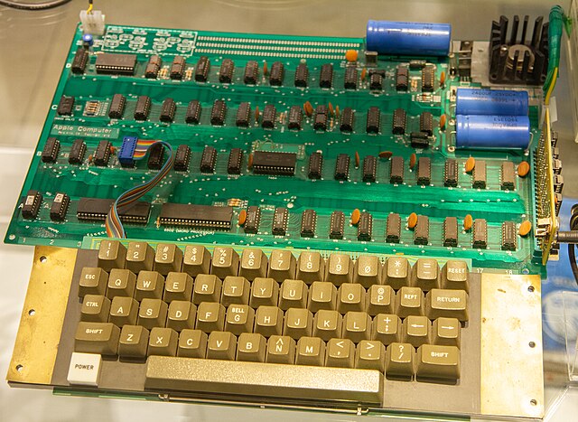 The Apple I is Apple's first product, designed by Wozniak and sold as an assembled circuit board without the required keyboard, monitor, power supply,