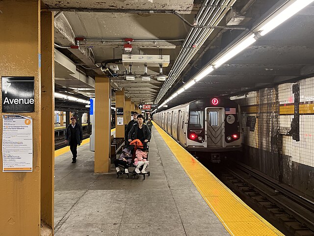 R160 F train departing the southbound platform