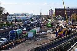 The dig site of the Mytongate Underpass on the A63 in Kingston upon Hull. Retaining walls have been built to the right-hand side of the road as a result of overnight road closures, and the framework for a road bridge over the underpass is in place.