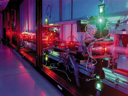 An atomic vapor laser isotope separation experiment at LLNL. The green light is from a copper vapor pump laser used to pump a highly tuned dye laser which is producing the orange light. AVLIS laser.jpg
