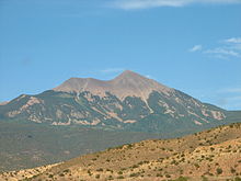 Little Tuk (left) and Mt. Tukuhnikivatz (right) of the La Sal Range in summer, seen from the south. A bare peak of La Sal.jpg