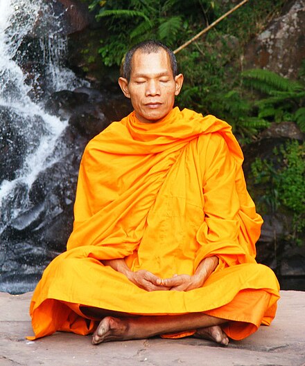 A Buddhist monk meditating