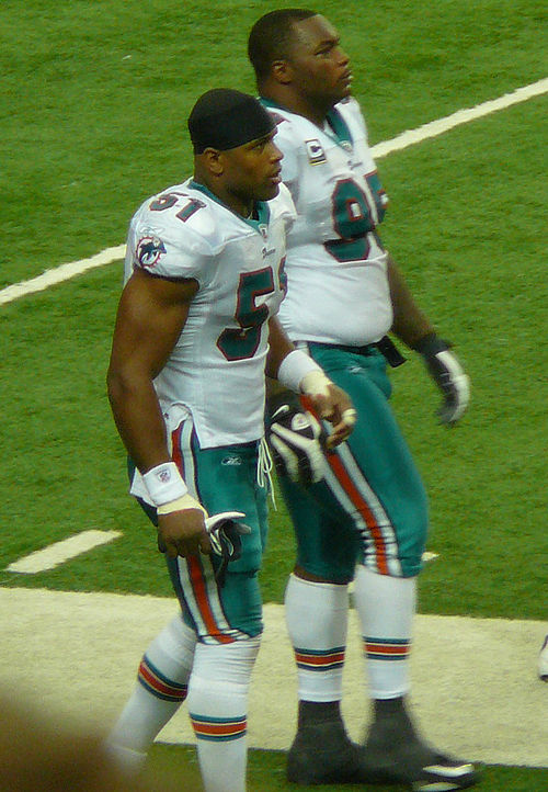 Former Cowboys teammates Ayodele (left) and Jason Ferguson in Miami in 2009.