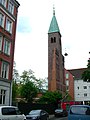 Belfry in a front, that originally was in line with the other buildings in the street.