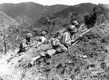 US troops approaching Japanese positions near Baguio, Luzon, 23 March 1945 Baleta Pass, near Baugio, Luzon.jpg