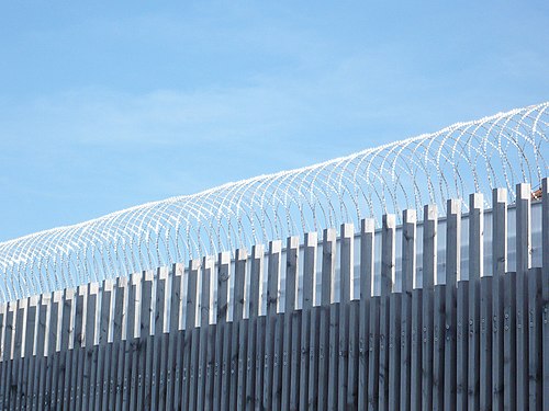 Barbed wire on top of former jail yard wall, Heidelberg, D