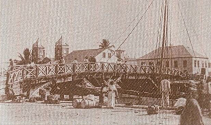 The original bridge that connected the North and South Side of Belize City (1859) Belize City's Original Swing Bridge (1859).png