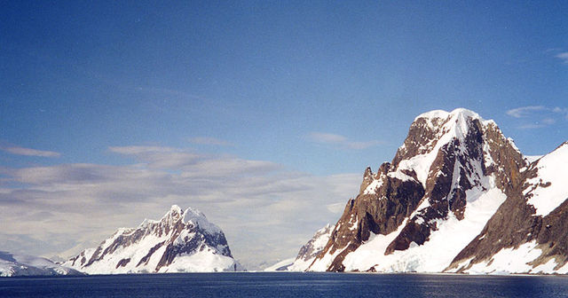 Booth Island and Mount Scott flank the narrow Lemaire Channel on the west side of the Antarctic Peninsula, 2001