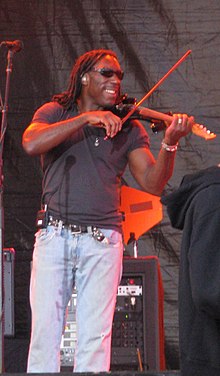 Tinsley playing an electric violin in July 2008