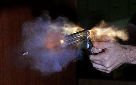 A high-speed photograph of a .38 Special bullet fired out of a Smith & Wesson Model 686 revolver.