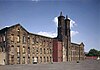 Photograph of the imposing brick Cannelton Cotton Mill prior to conversion to apartments.