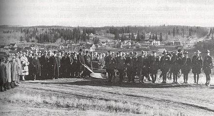 Stewart (behind the plow) at a sod-turning event in St. Albert, soon after becoming premier
