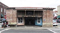 Church Street entrance to the market, with Gullah sweetgrass basket vendors on the left Charleston-city-market-shed-sc2.jpg