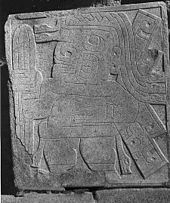 Stone carving from Chavin de Huantar, dated to circa 1000 BC, showing a figure carrying what is thought to be the San Pedro cactus, Trichocereus macrogonus var. pachanoi. Chavin-cactus-stone.jpg