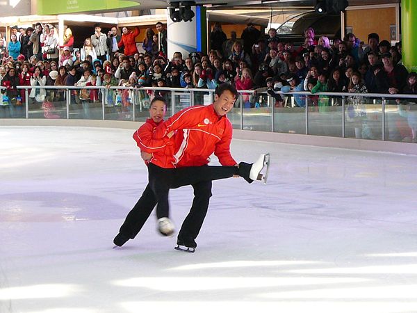 Shen and Zhao in an outdoor performance after winning gold at the 2010 Winter Olympics.