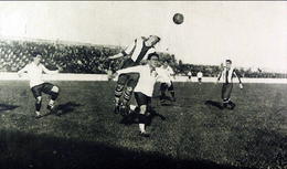 Arellano (center, white shirt), in a match between Colo-Colo and La Coruna in 1927, is credited with popularizing the move. Colo-Colo v Deportivo La Coruna (1927).png