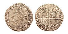 Silver sixpence struck 1593 identifying Elizabeth as by the Grace of God Queen of England, France, and Ireland