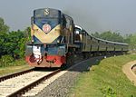 The Faridpur Express travels near Giandia Bazar, Faridpur, Bangladesh, in 2014