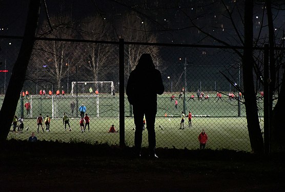 a man behind a fence