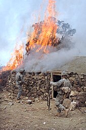 US soldiers burning a suspected Taliban safehouse in March 2007 GIs burn a house described as a Taliban safehouse.jpg