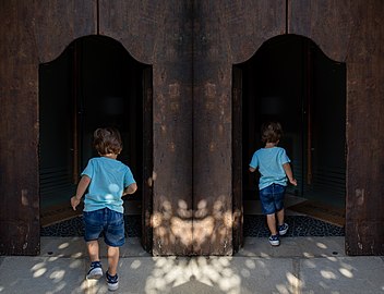 Gabriel entering an old door, Corso Vittoria Emanuele, Tolve, Italy