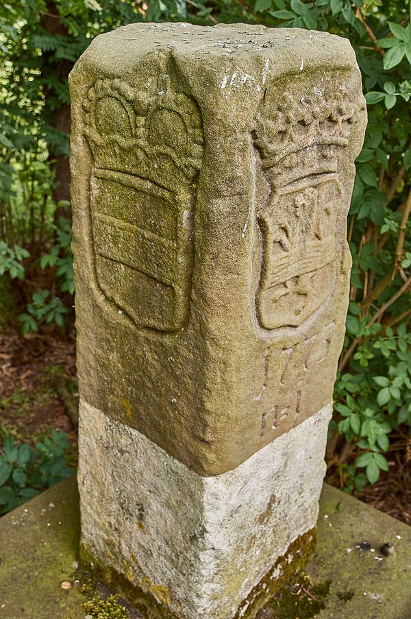 Stone marker from 1766 demarcating the territories of the Prince-Bishopric of Münster (coat of arms on the left side) and the Dutch province of Overij