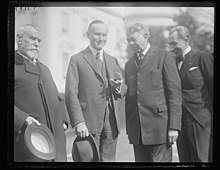 The first Huguenot-Walloon half dollar presented to President Calvin Coolidge by Dr. Charles S. MacFarland, President of the Tercentenary Commission, in February 1924. To the left is Jean Jules Jusserand, French Ambassador to the United States, and to the right is Emile de Cartier de Marchienne, Belgian Ambassador to the United States.