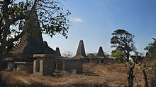 A striking feature of a Sumbanese village is that houses intermingle with tombs. Houses of Wainyapu, Kodi.jpg