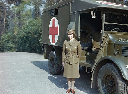 Princess Elizabeth (later Queen Elizabeth II) next to an ambulance during her time in the Auxiliary Territorial Service in the Second World War