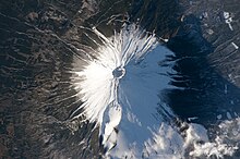 Mount Fuji in Honshu, Japan, was photographed in February 2016, using the most powerful camera lens then aboard the ISS. The photograph shows details of Japan's famous volcano, including switchbacks in the trail leading to the summit crater and features of the Hoei flank crater. ISS-46 Mount Fuji, Japan.jpg