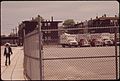 LOGAN AIRPORT AREA. LOVELL STREET HOMES SEEN THROUGH FENCE OF TRUCKING FIRM AT LOVELL AND FRANKFORT INTERSECTION.... - NARA - 549277.jpg