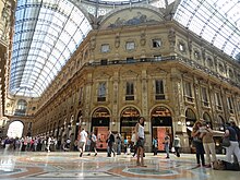 The Galleria Vittorio Emanuele II interior in Milan which opened in 1877 Louis Vuitton in Galeria V. Emanuele, Milan, Italy (9471446737).jpg